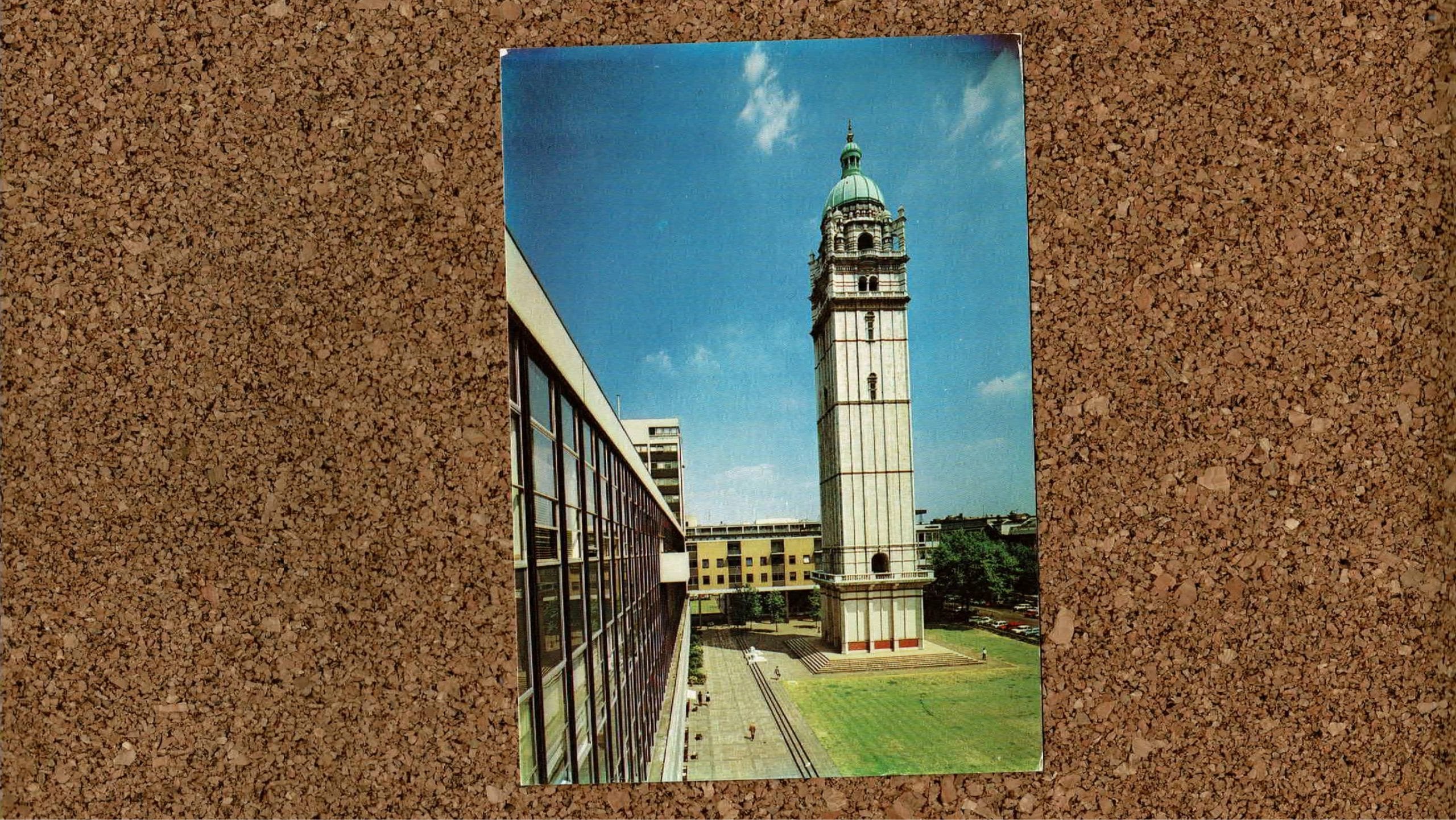 Image of Imperial Queens Tower postcard on a cork background