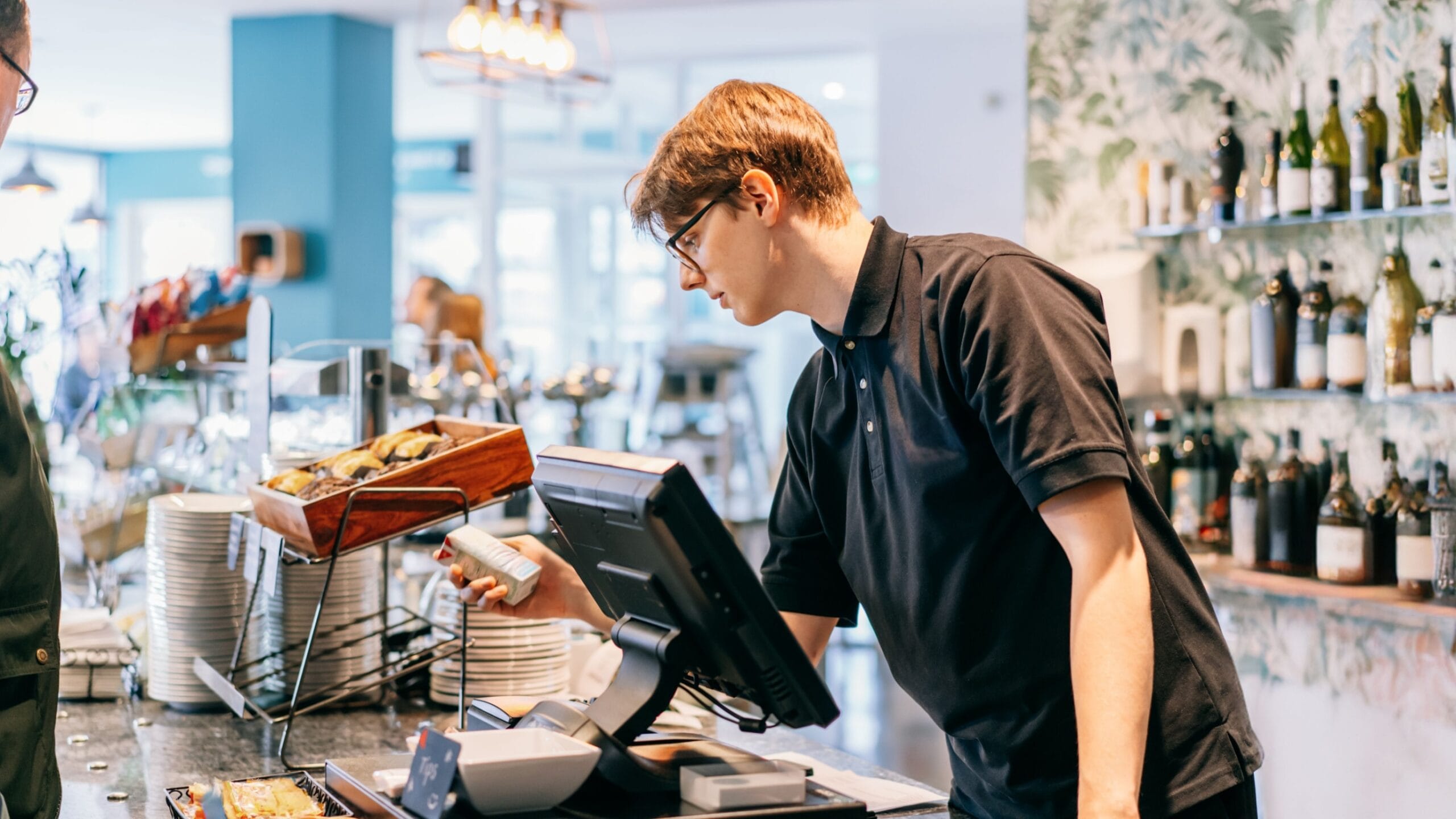 Young person working in a cafe