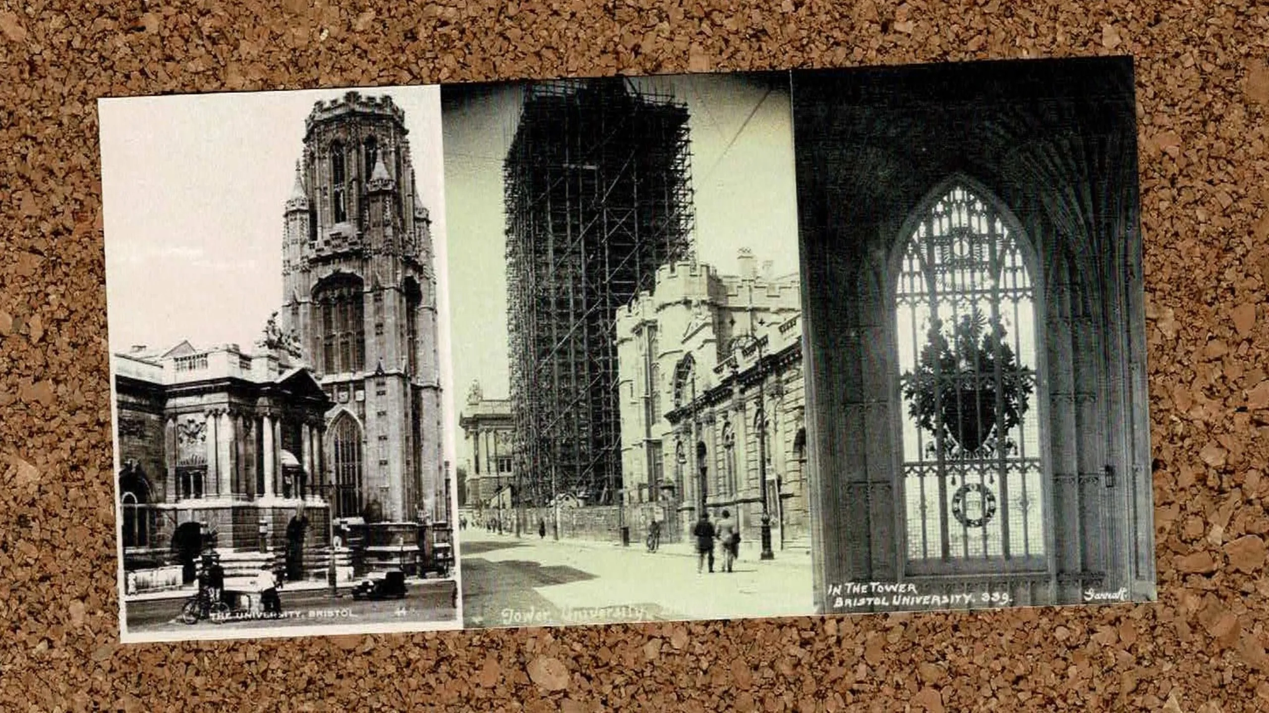 Three postcards of the Wills Tower in Bristol on a cork board