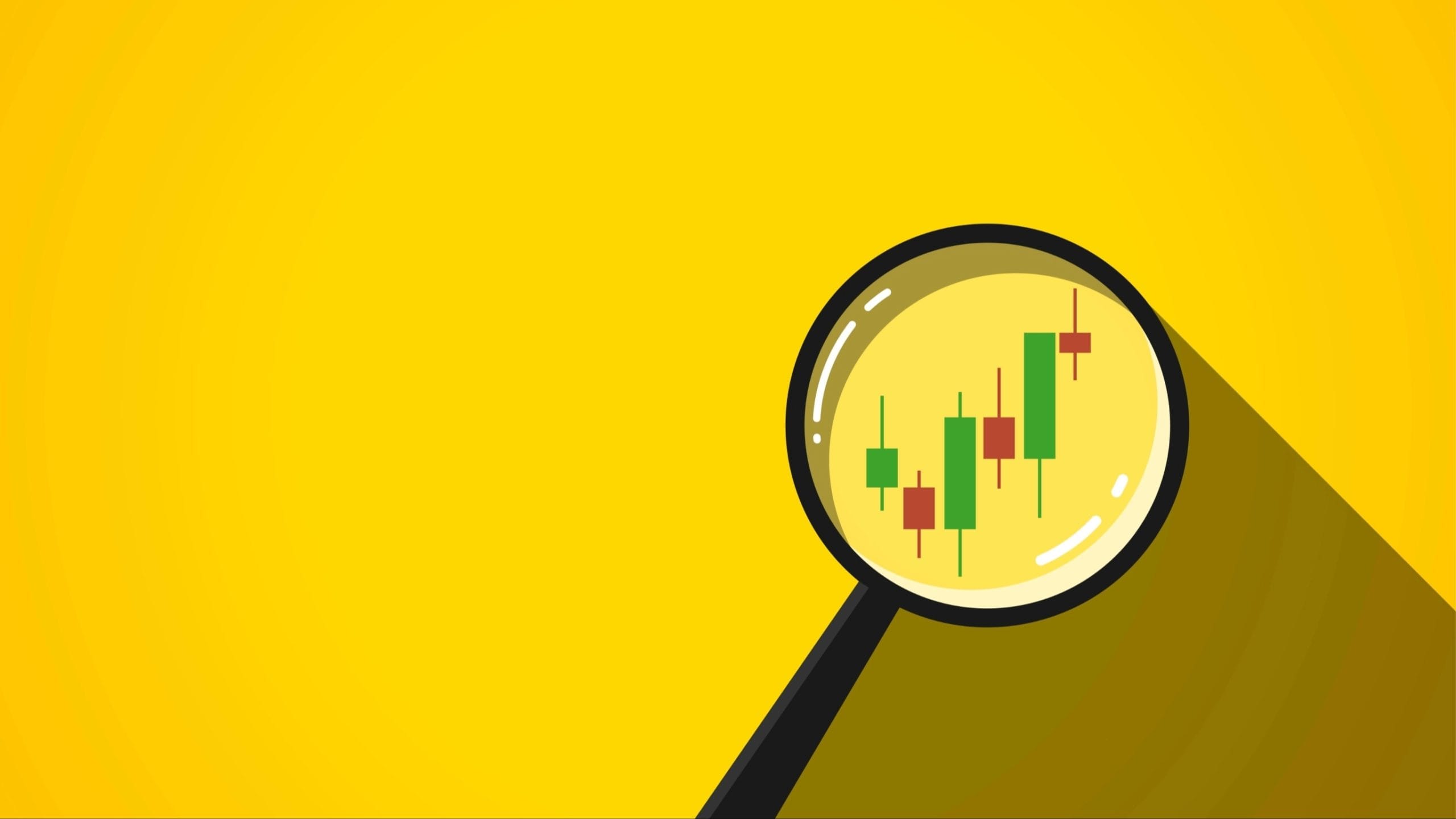 Image of a magnifying glass looking at charts