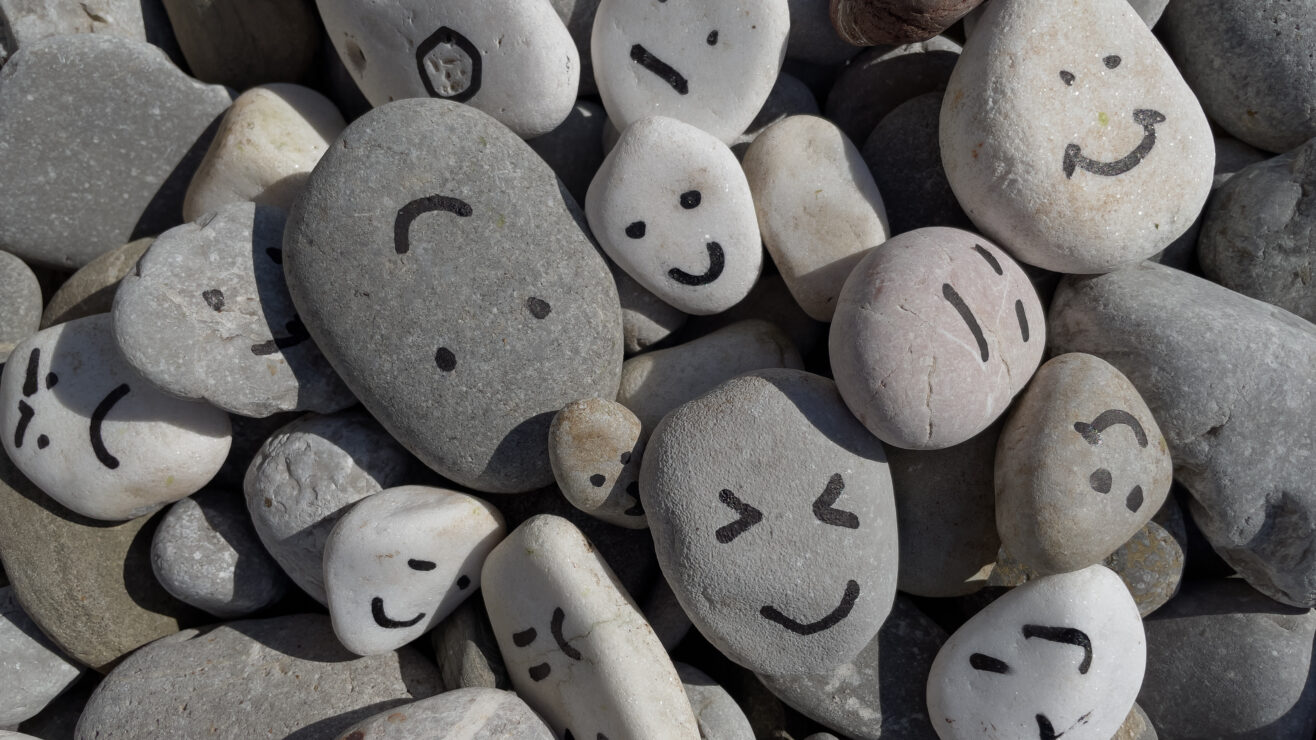 Emotion,Management,Concept,,Stones,With,Painted,Faces,Symbolize,Different,Emotions.