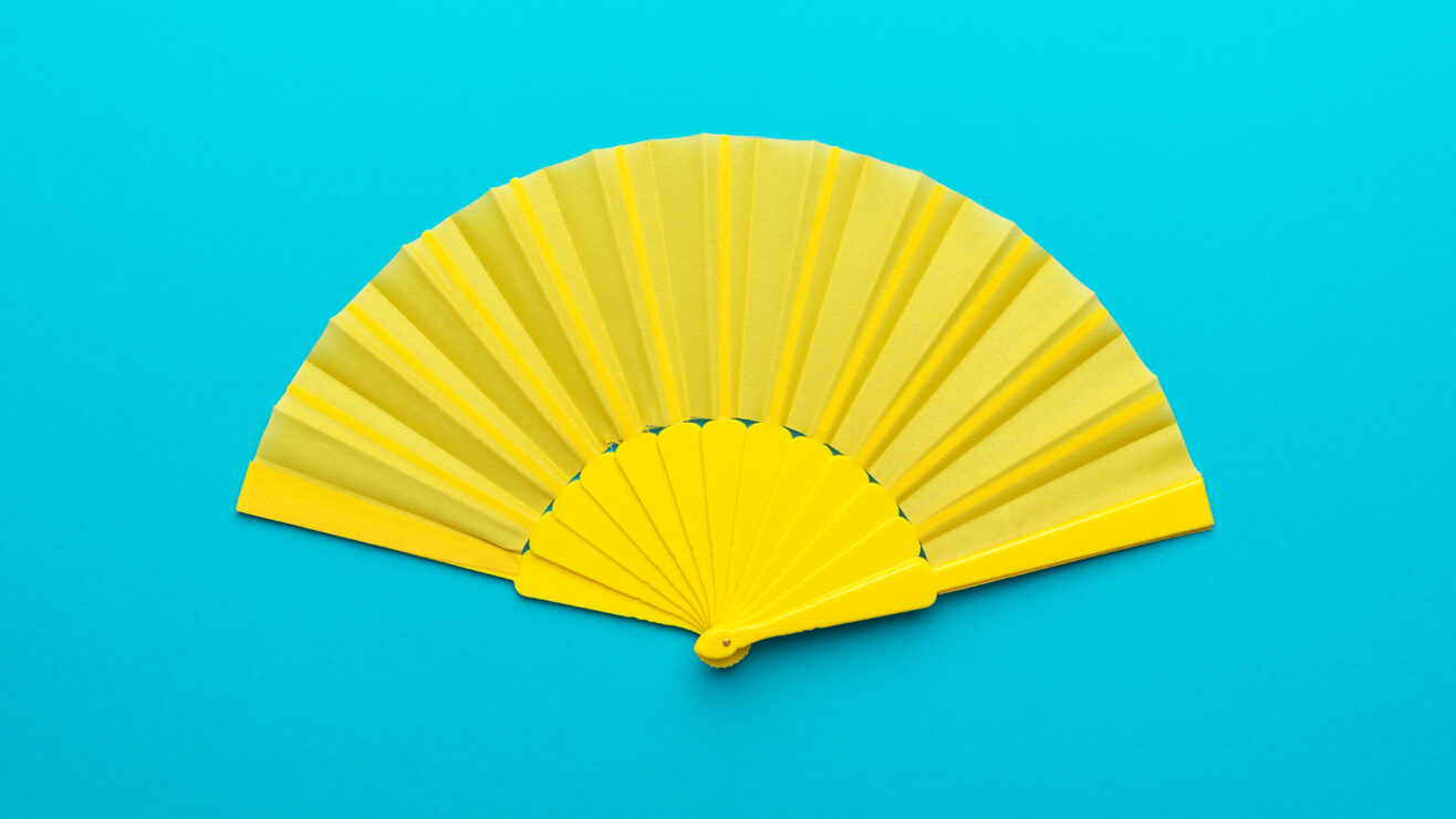 Top,View,Of,Opened,Yellow,Fan,Mockup,Over,Blue,Turquoise