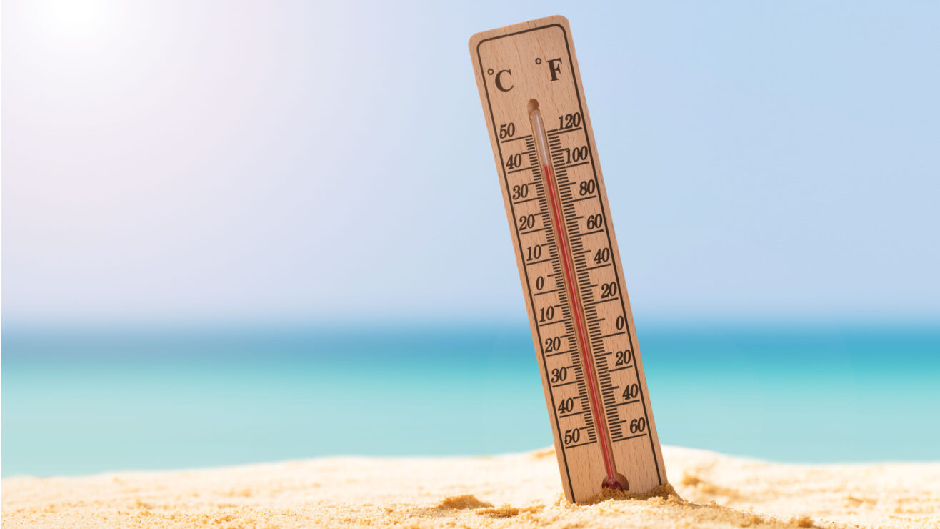 Close-up,Of,Thermometer,On,Sand,Showing,High,Temperature