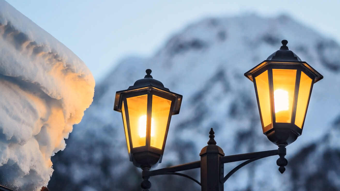 Dual,Street,Lamp,Pillar,On,Snowy,Mountain,Peak,Winter,Evening