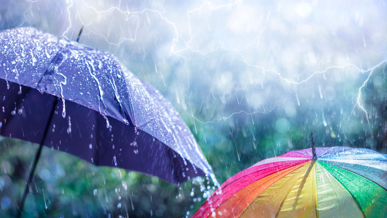 Abstract,Weather,Concept,-,Rain,And,Lightning,On,Black,Umbrella