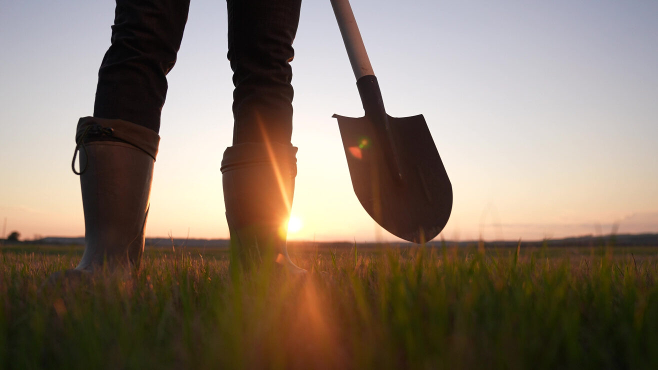 Agriculture.,Farmer,With,A,Shovel,Walk,In,The,Field.,Agriculture