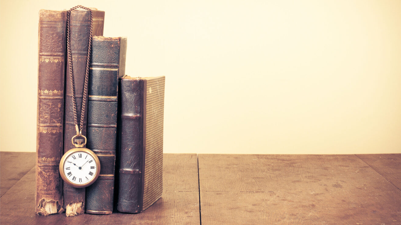 Old,Vintage,Books,And,Pocket,Watches,On,Wooden,Desk.,Retro