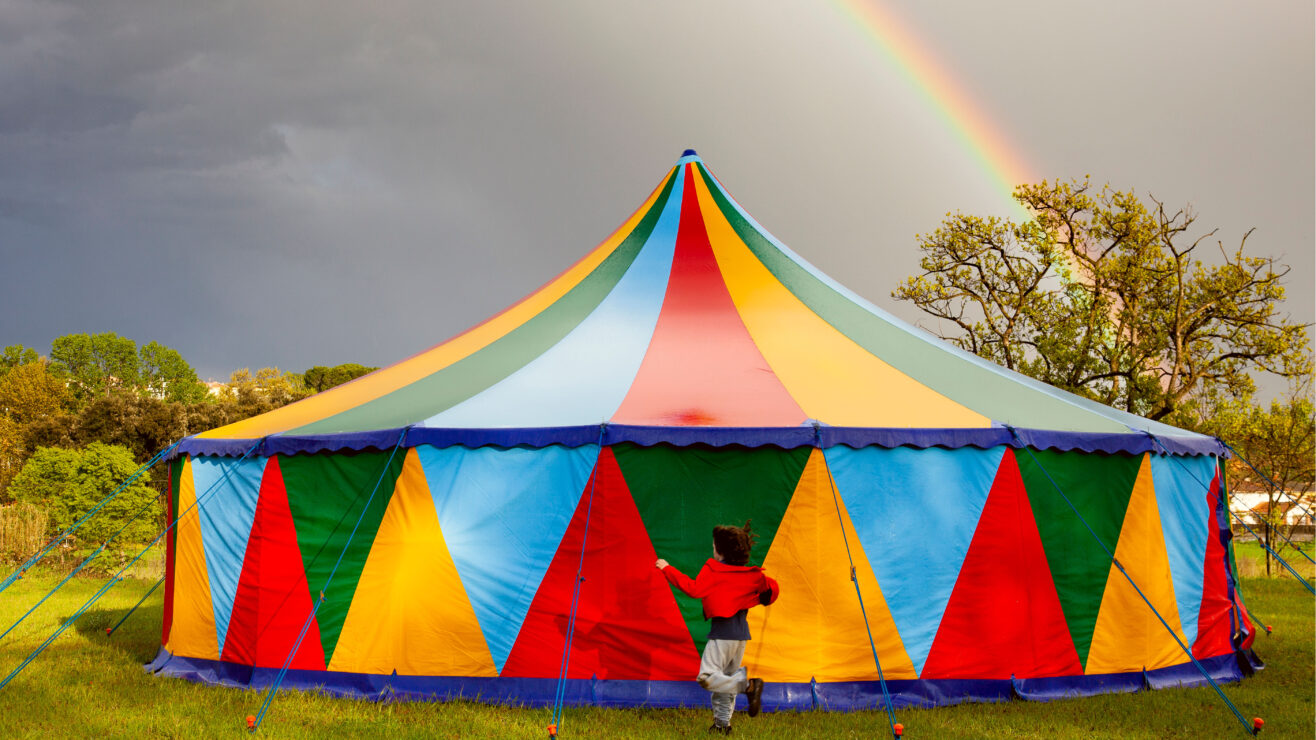 Colored,Circus,Tent,In,A,Rainy,Day,With,A,Rainbow