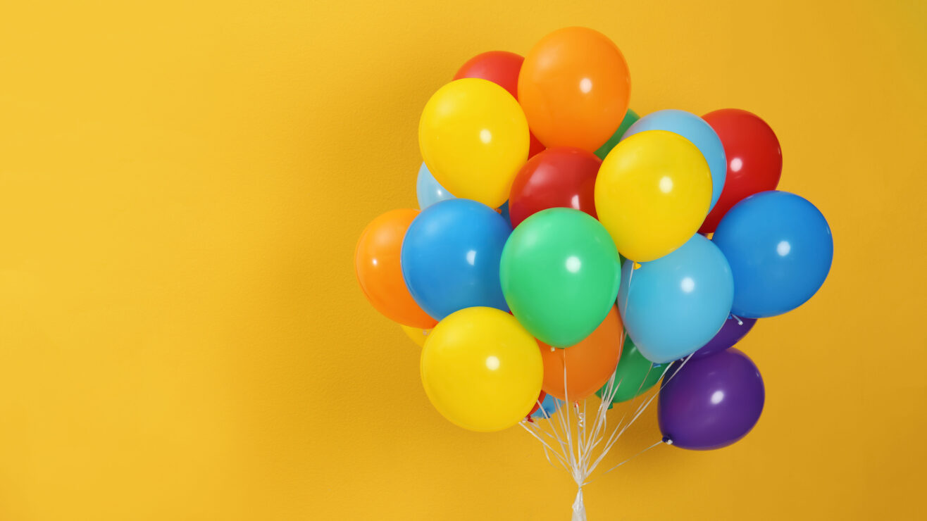 Bunch,Of,Bright,Balloons,And,Space,For,Text,Against,Color