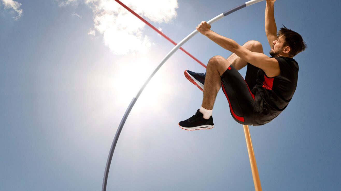 Professional,Pole,Vaulter,Training,At,The,Stadium.,Copy,Space,Background