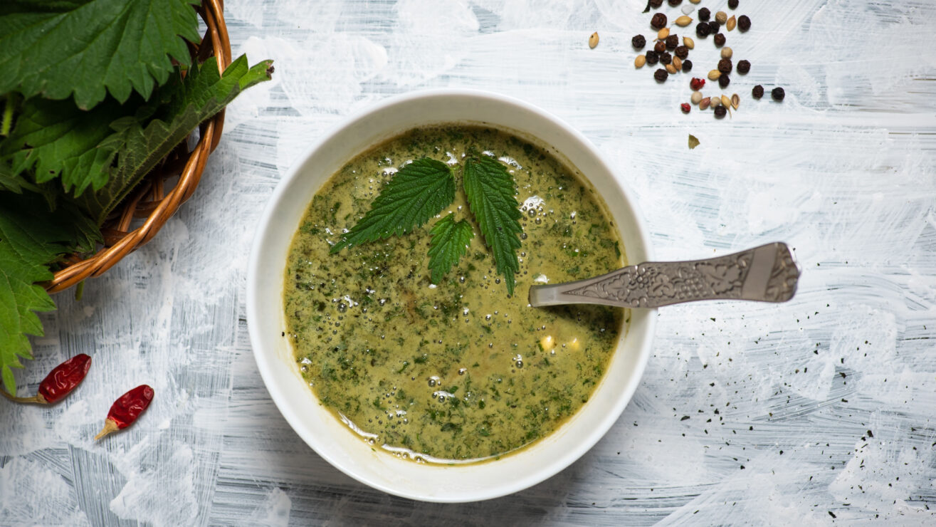 Refreshing,Green,Creamy,Nettle,Soup,In,A,White,Bowl,On