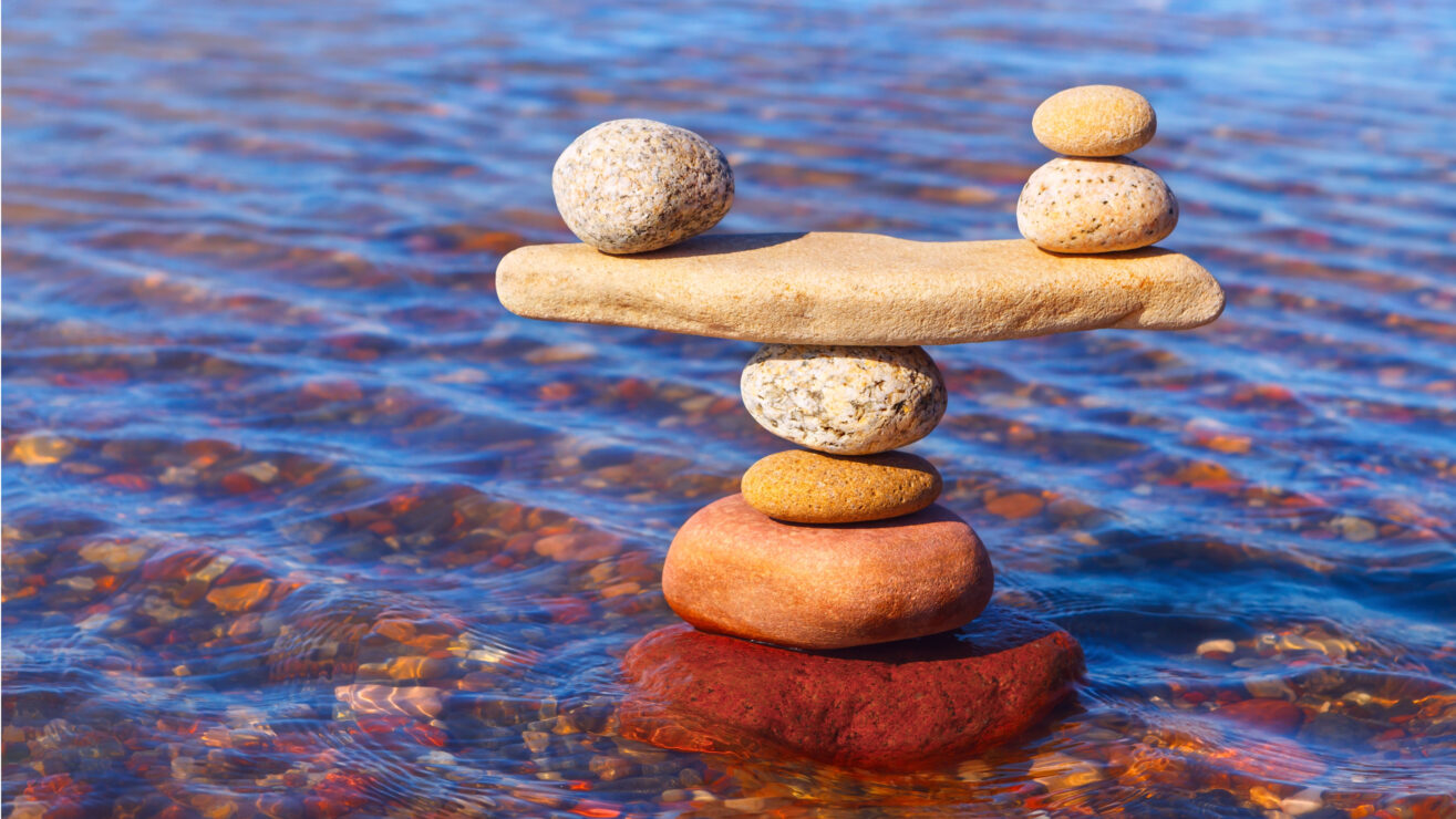 Symbolic,Scale,Of,The,Stones,On,Sea,Background.,Concept,Of