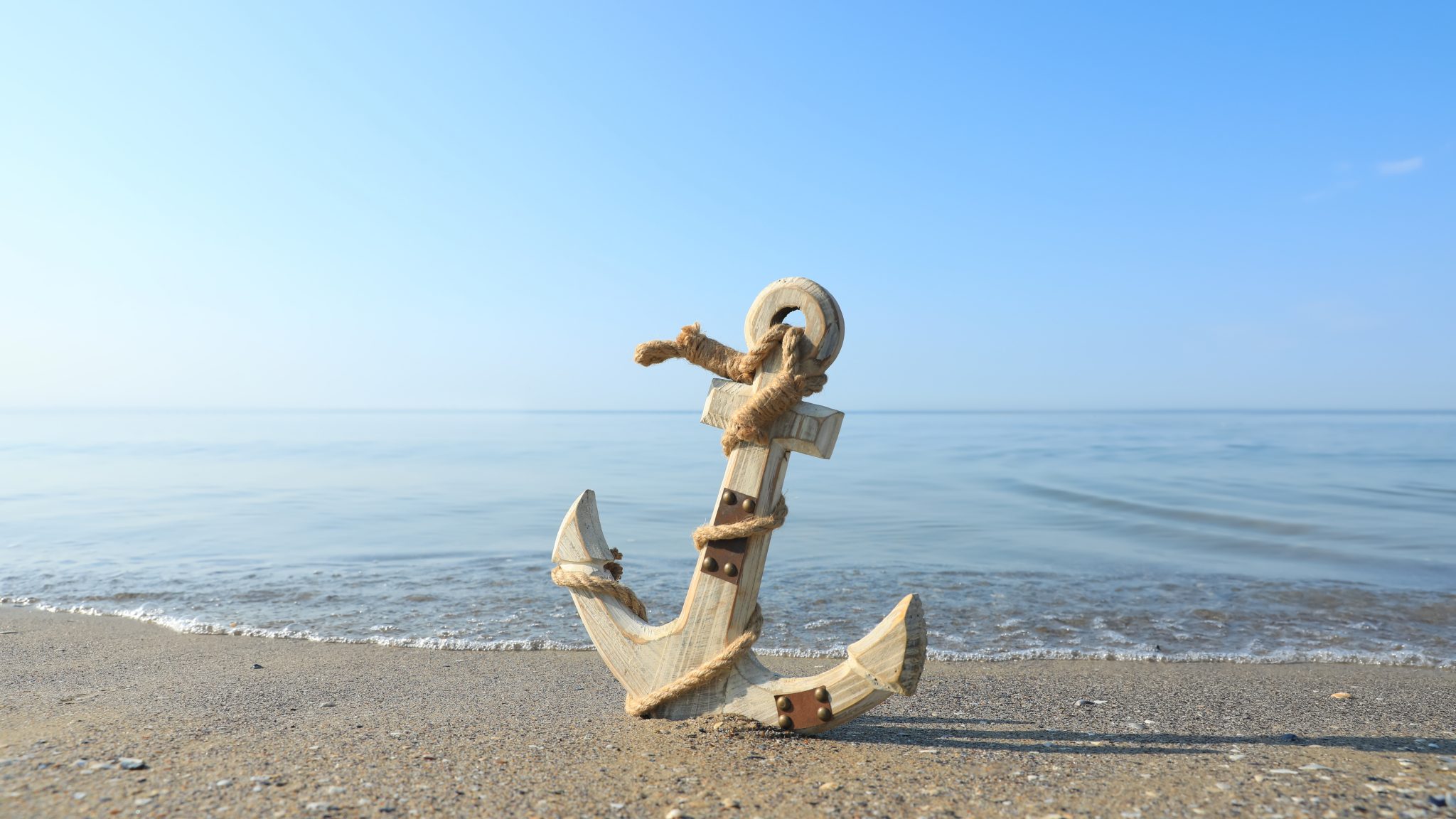 Wooden,Anchor,With,Rope,On,Sand,Near,Sea