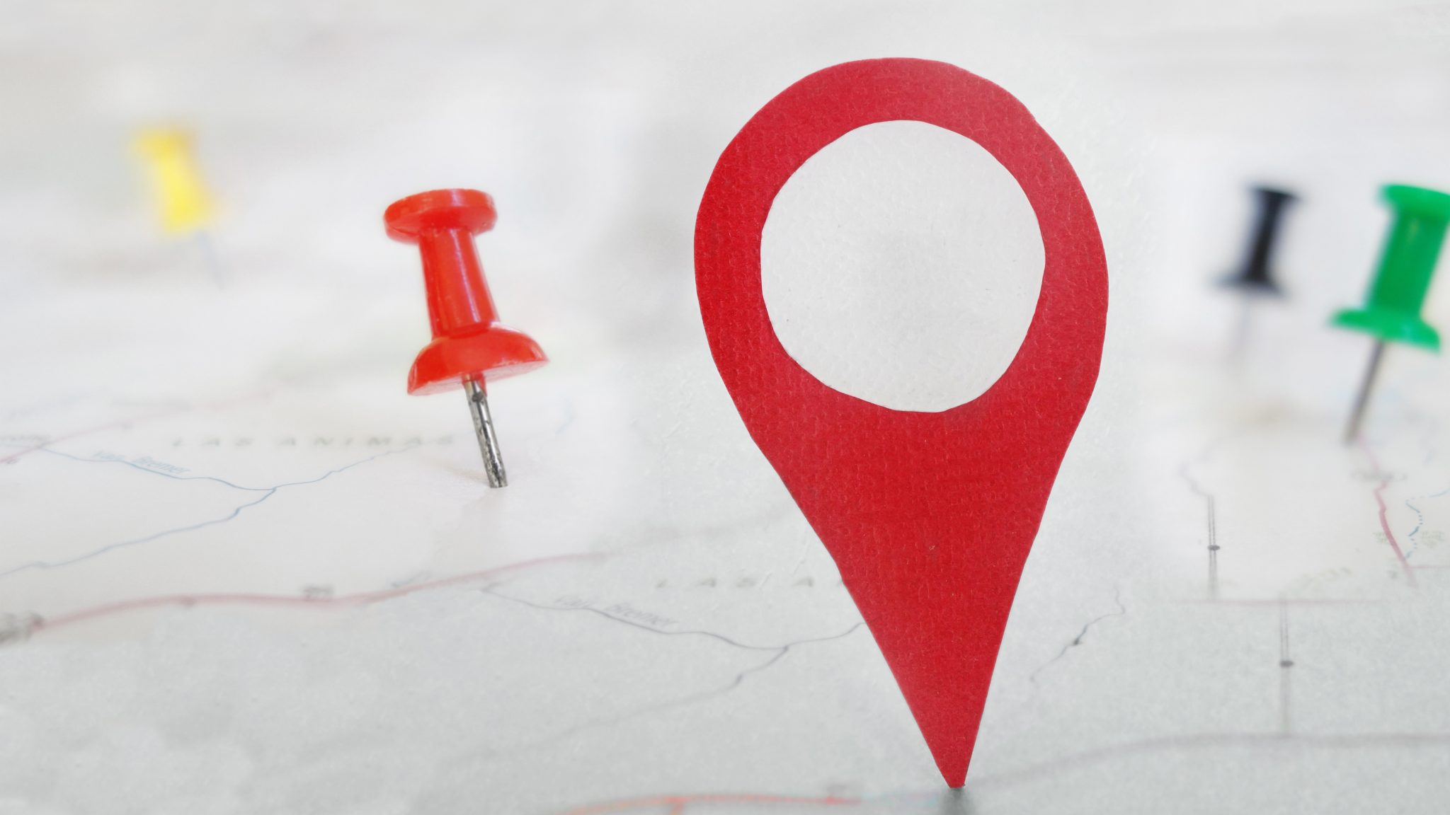 Red,Locator,Symbol,On,A,Map,With,Tacks